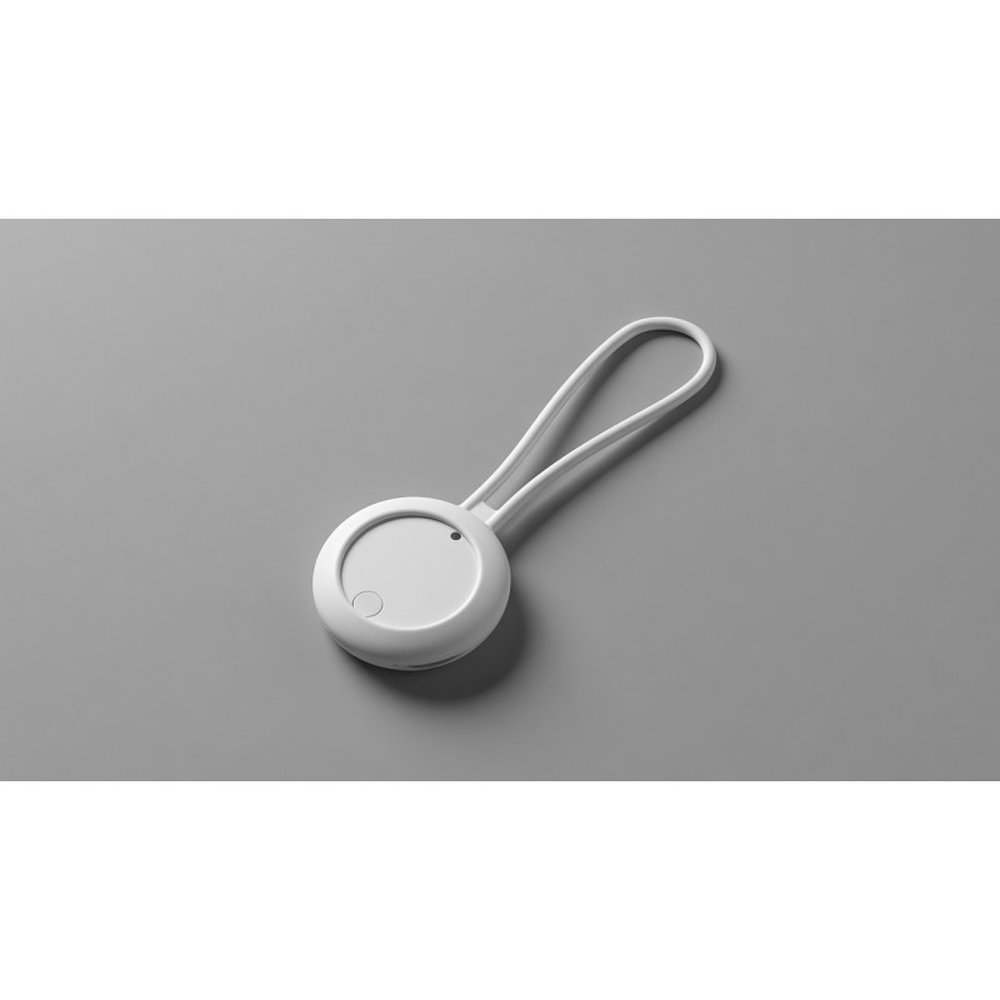 Tag connecté de localisation avec porte-clés silicone sur fond gris